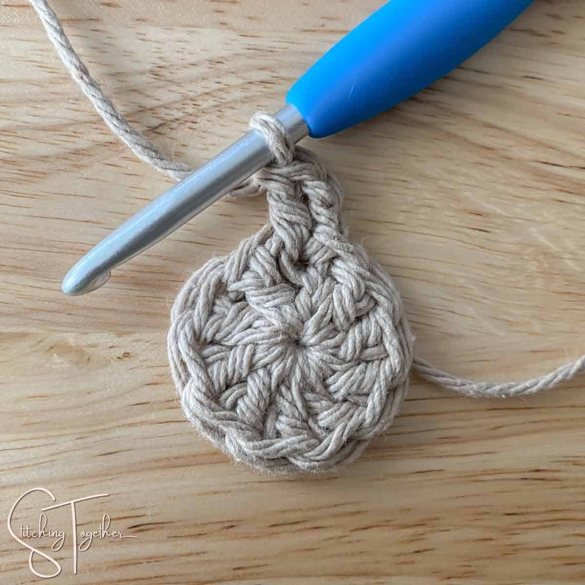 starting round 2 of a crochet crochet circle