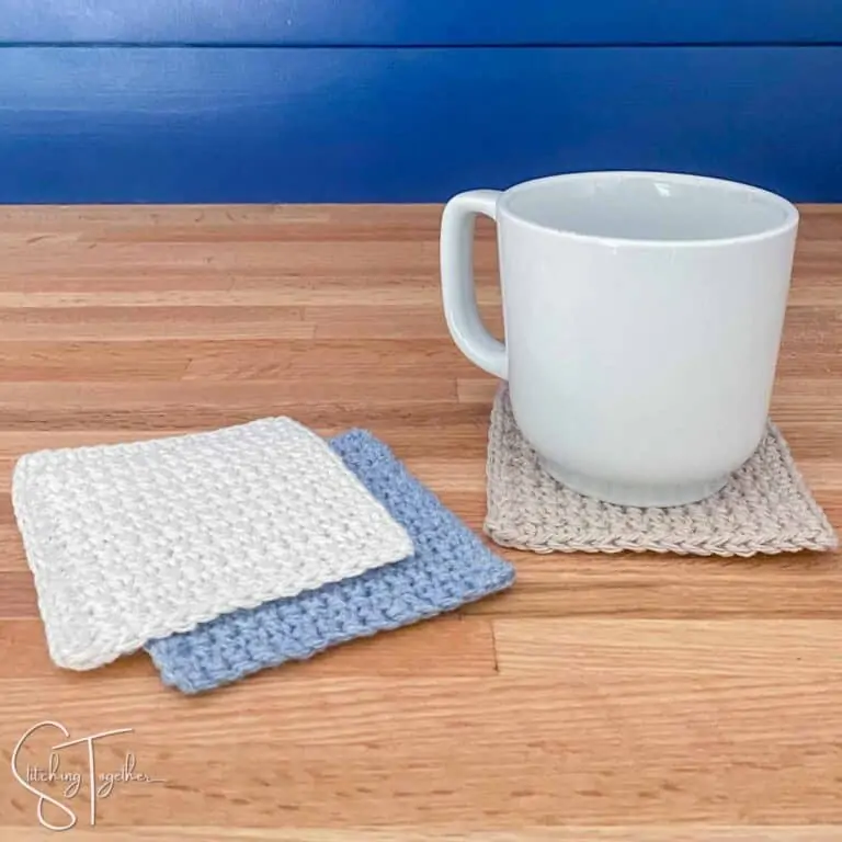 mug sitting on a square crochet coaster with other coaster next to it