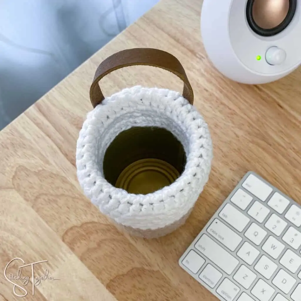 top view of a crochet pen holder with a can inside to give it structure