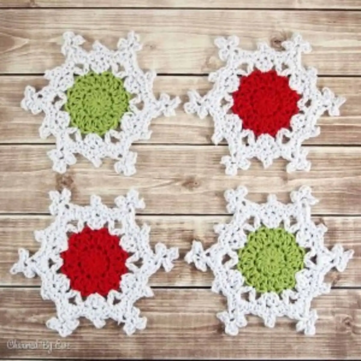 crochet snowflake coasters that have differently colored centers