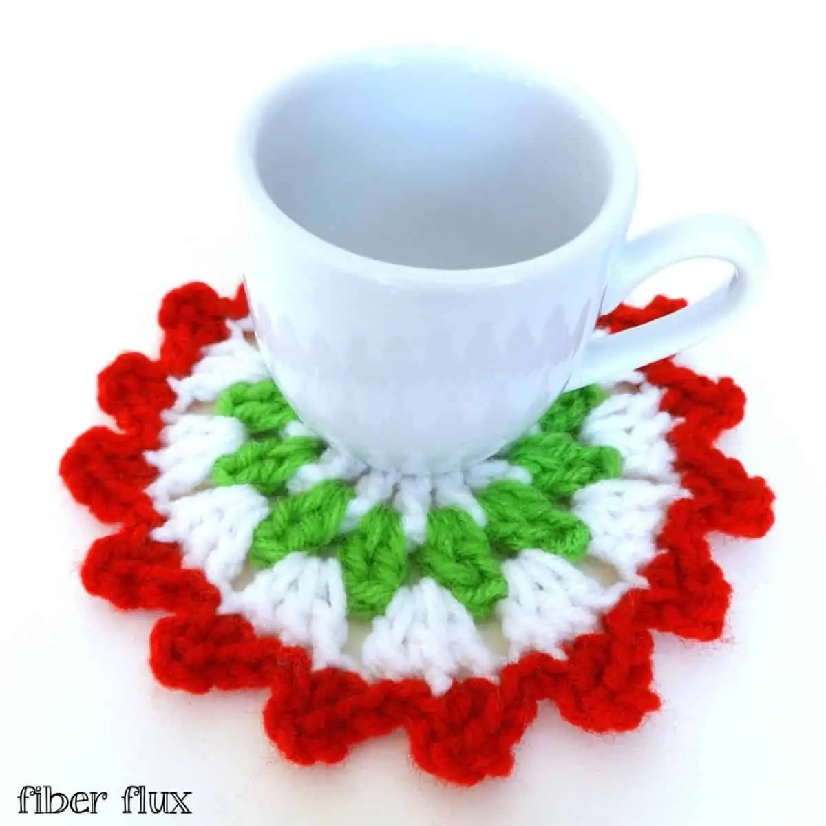mug sitting on a white, green and red round crocheted coaster