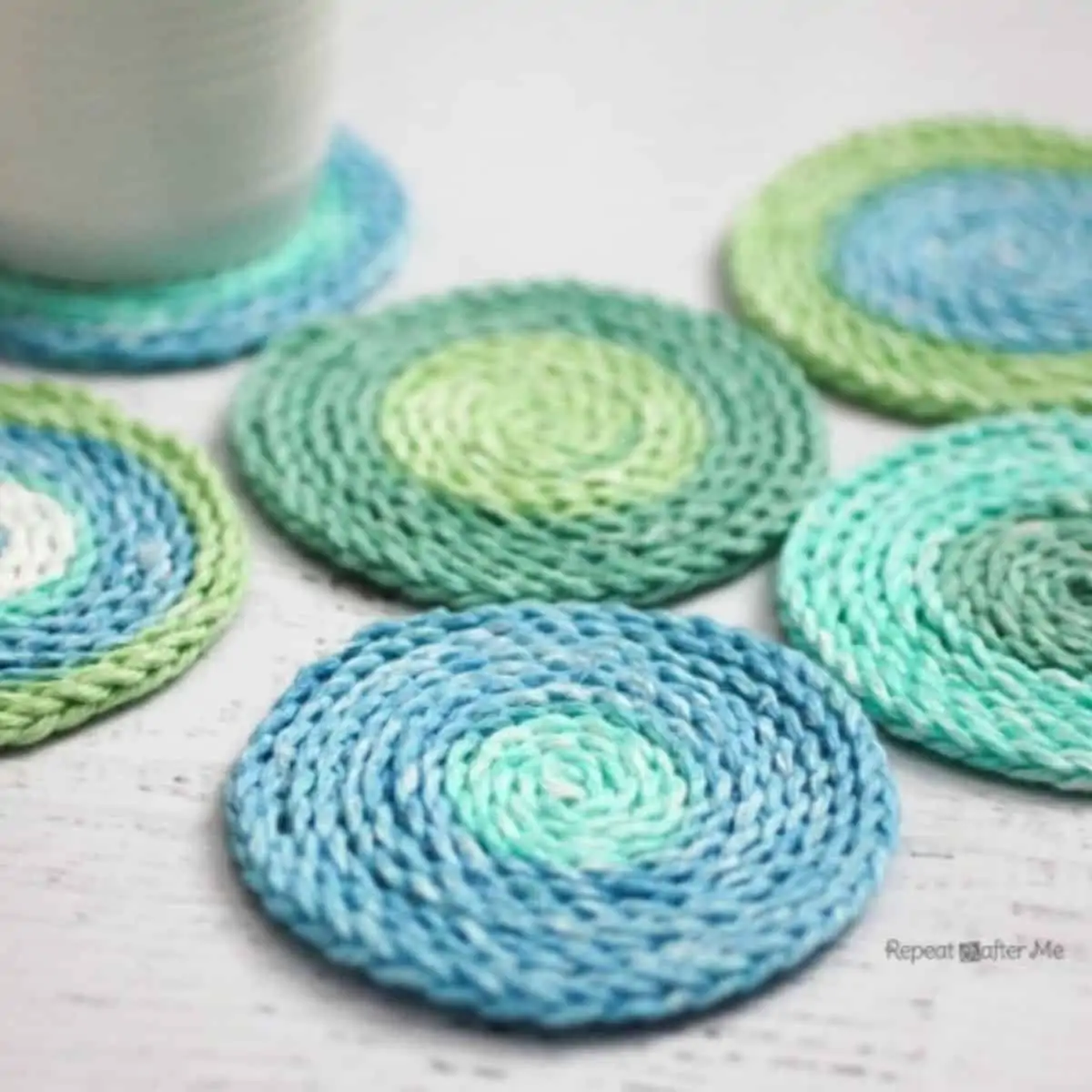 round coasters made with variegated blue green yarn