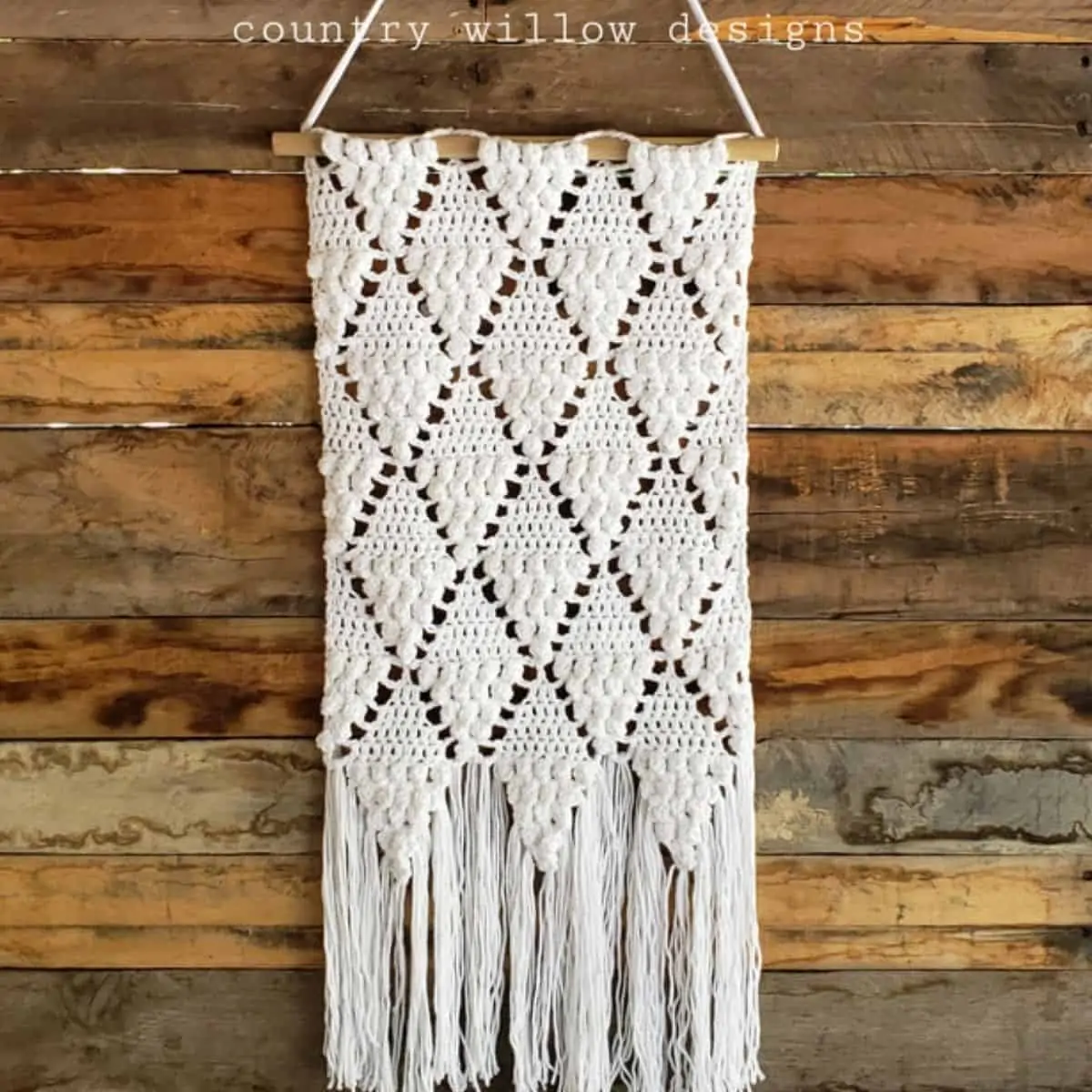 off white crochet wall hanging with diamond pattern