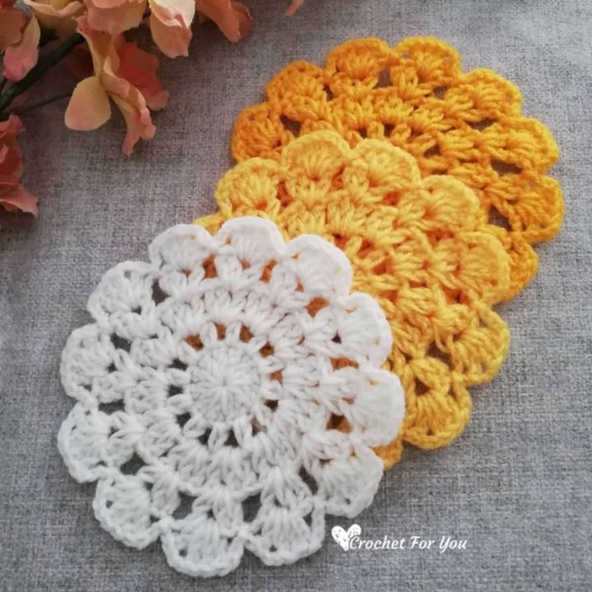 round crochet coasters that appear to be flowers
