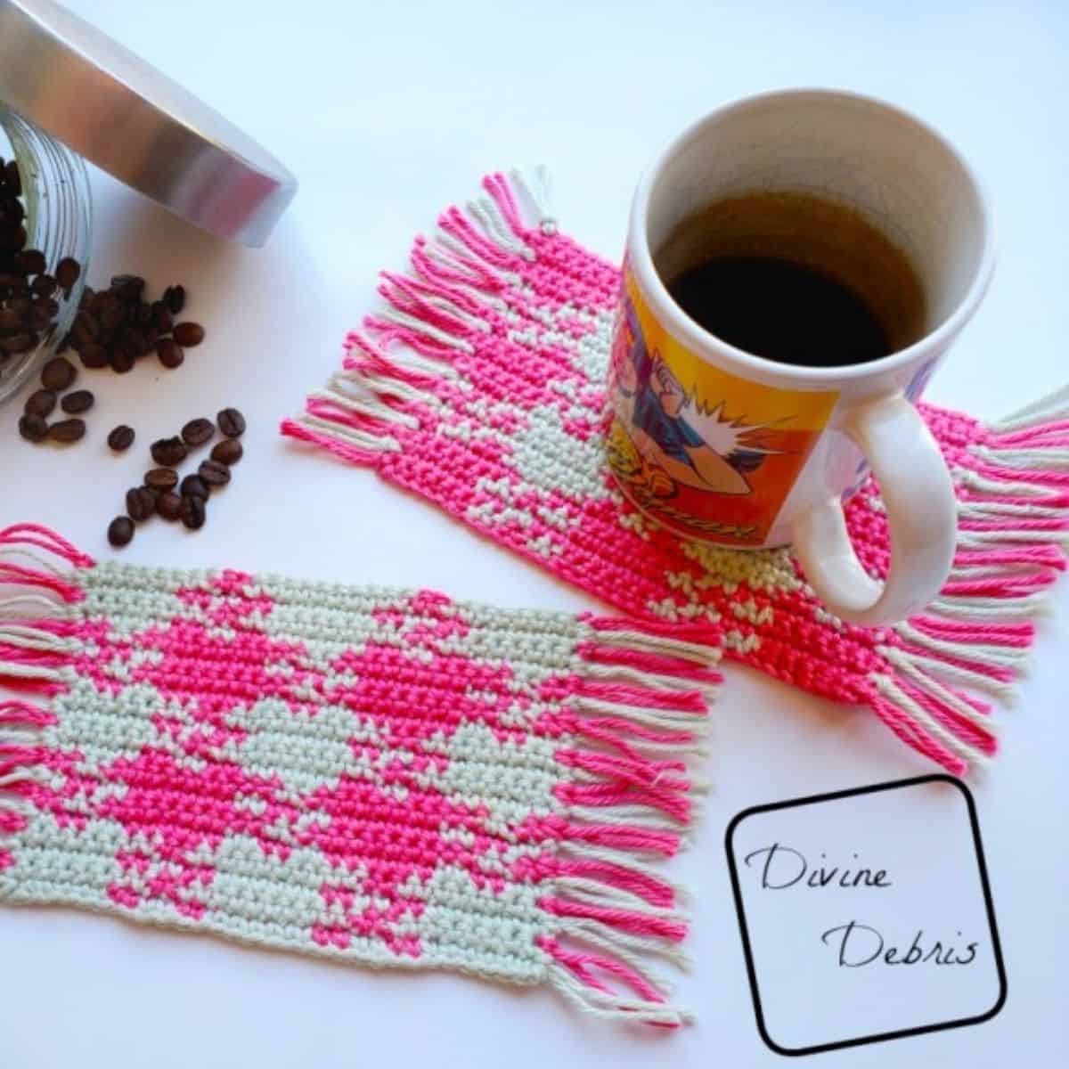 pink and white gingham coasters with a mug of coffee and coffee beans spilled out