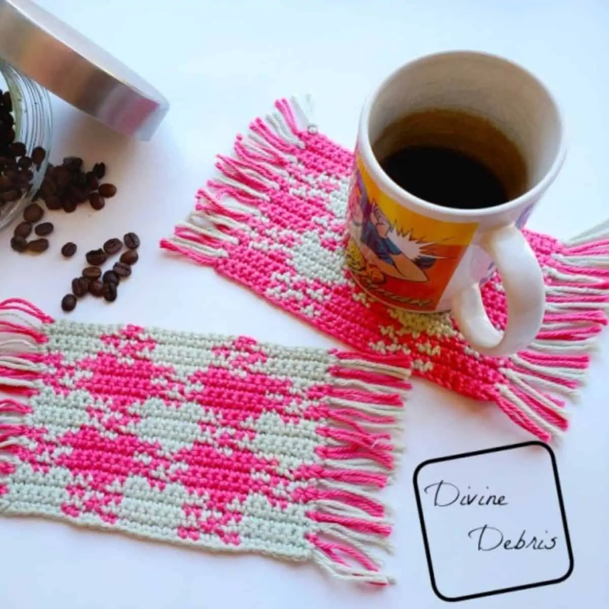 pink and white gingham coasters with a mug of coffee and coffee beans spilled out