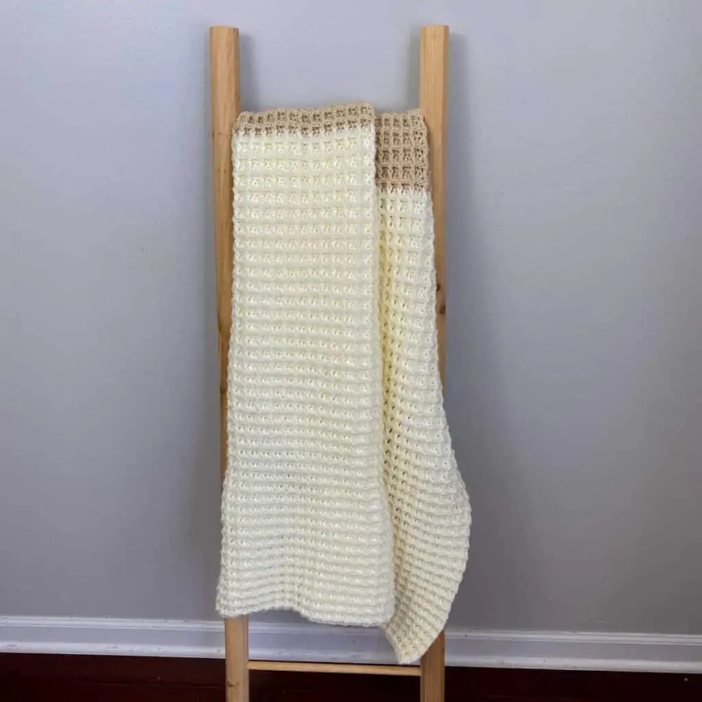 2 toned waffle blanket hanging on a blanket ladder