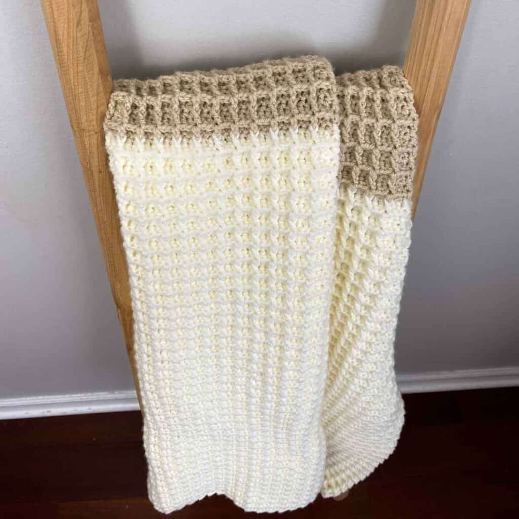 looking down view of waffle stitch blanket hanging on a blanket ladder
