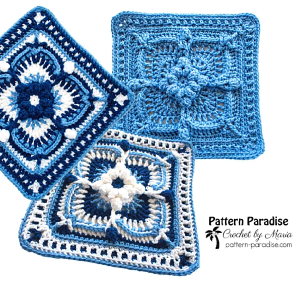 three crochet granny squares in shades of blue with a raised flower motif