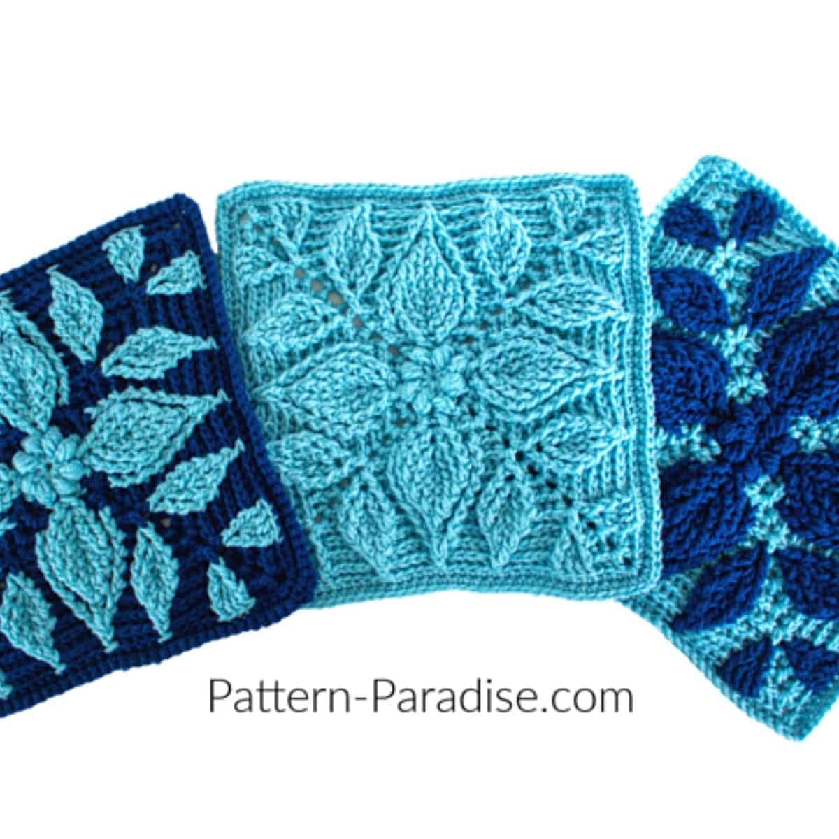 three crochet granny squares in shades of blue with a raised flower or snowflake motif