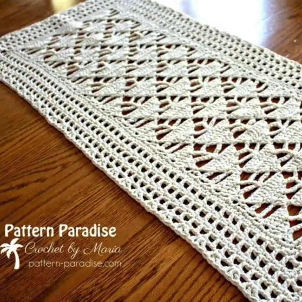neutral crochet table runner with a triangle motif