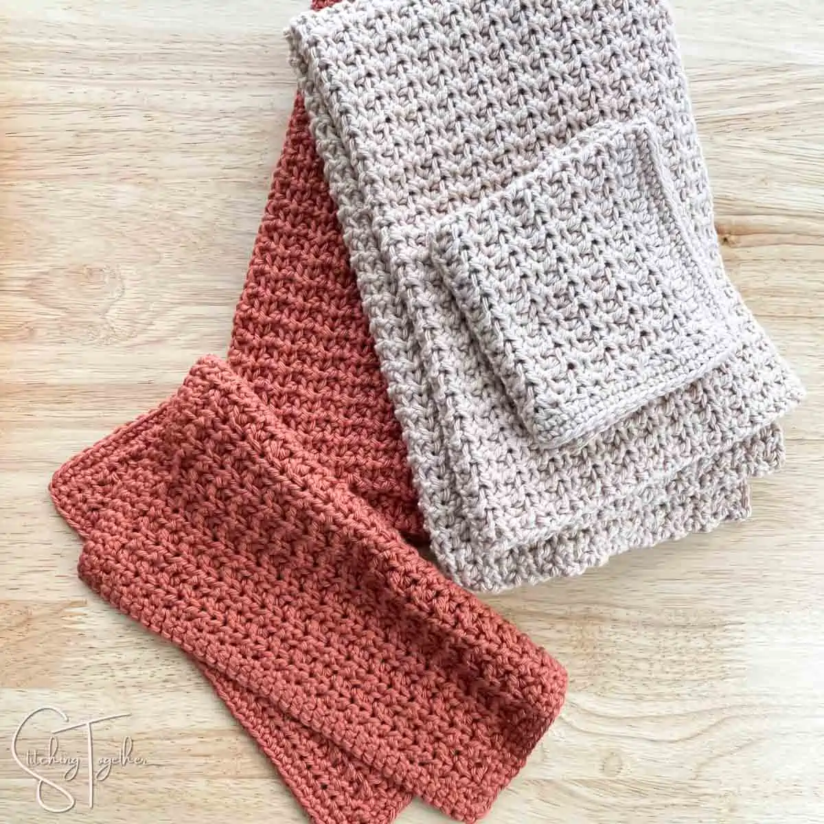 crochet hand towels and crochet washcloths folded and laying next to or on each other