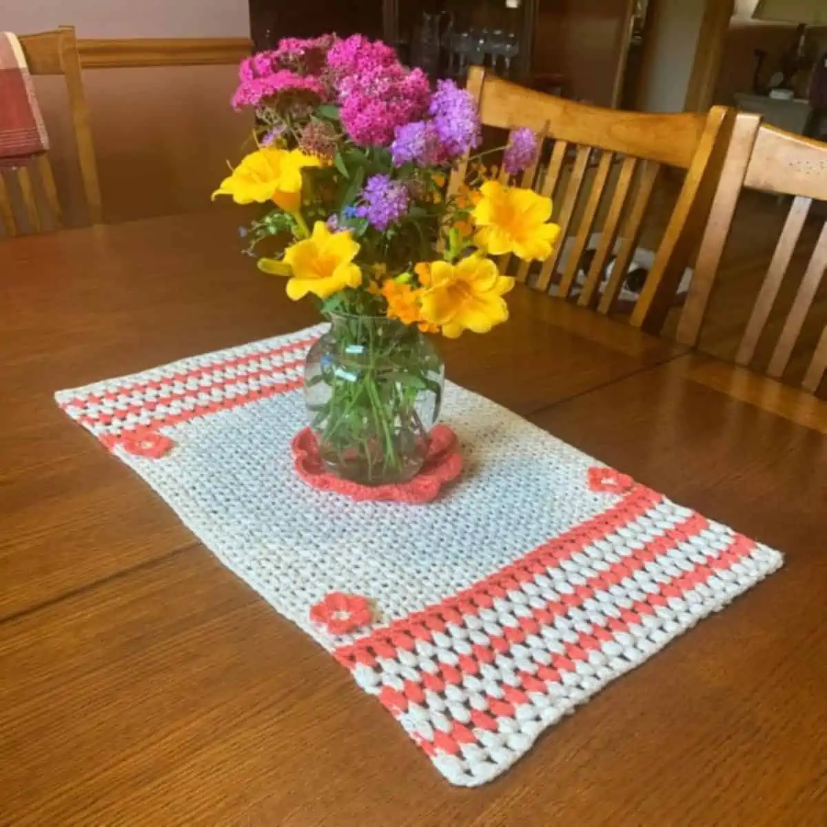 small crochet placemat as a centerpiece with flowers