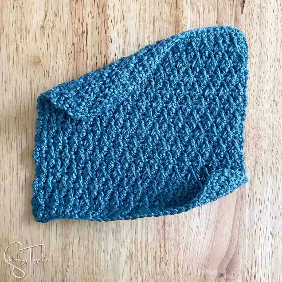 crochet swatch with curled edges before blocking