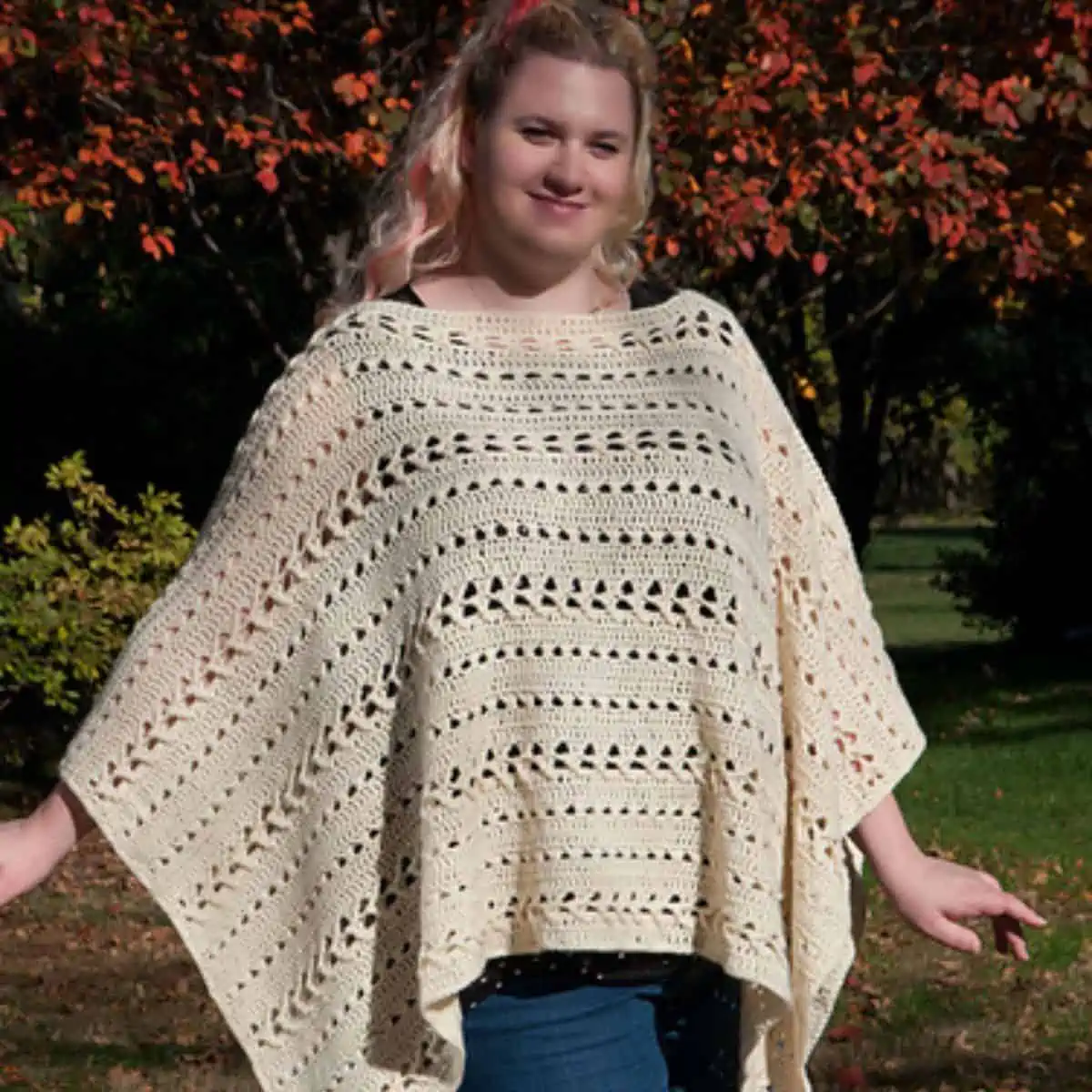 open stitch crochet poncho on a woman