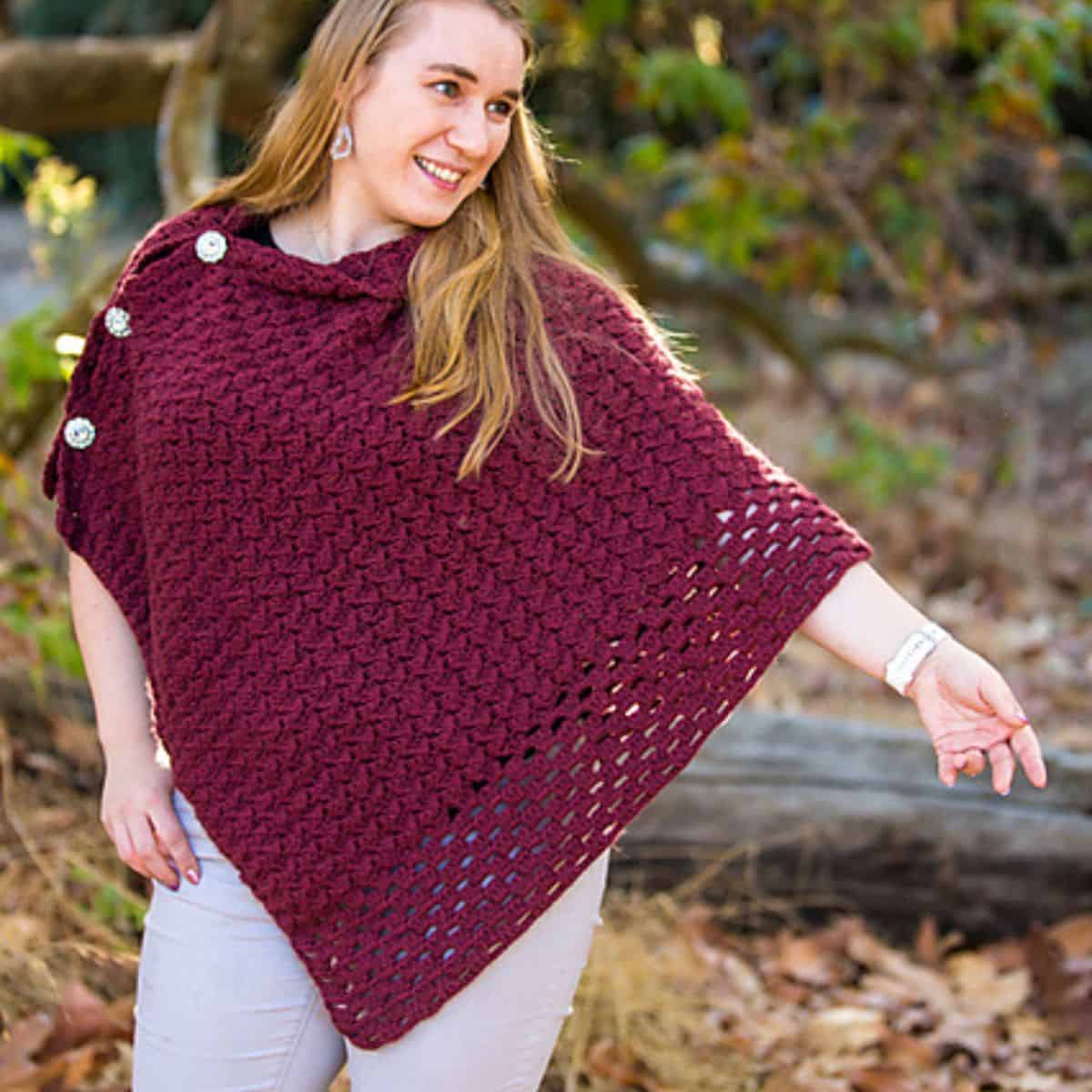 maroon crochet poncho on a woman