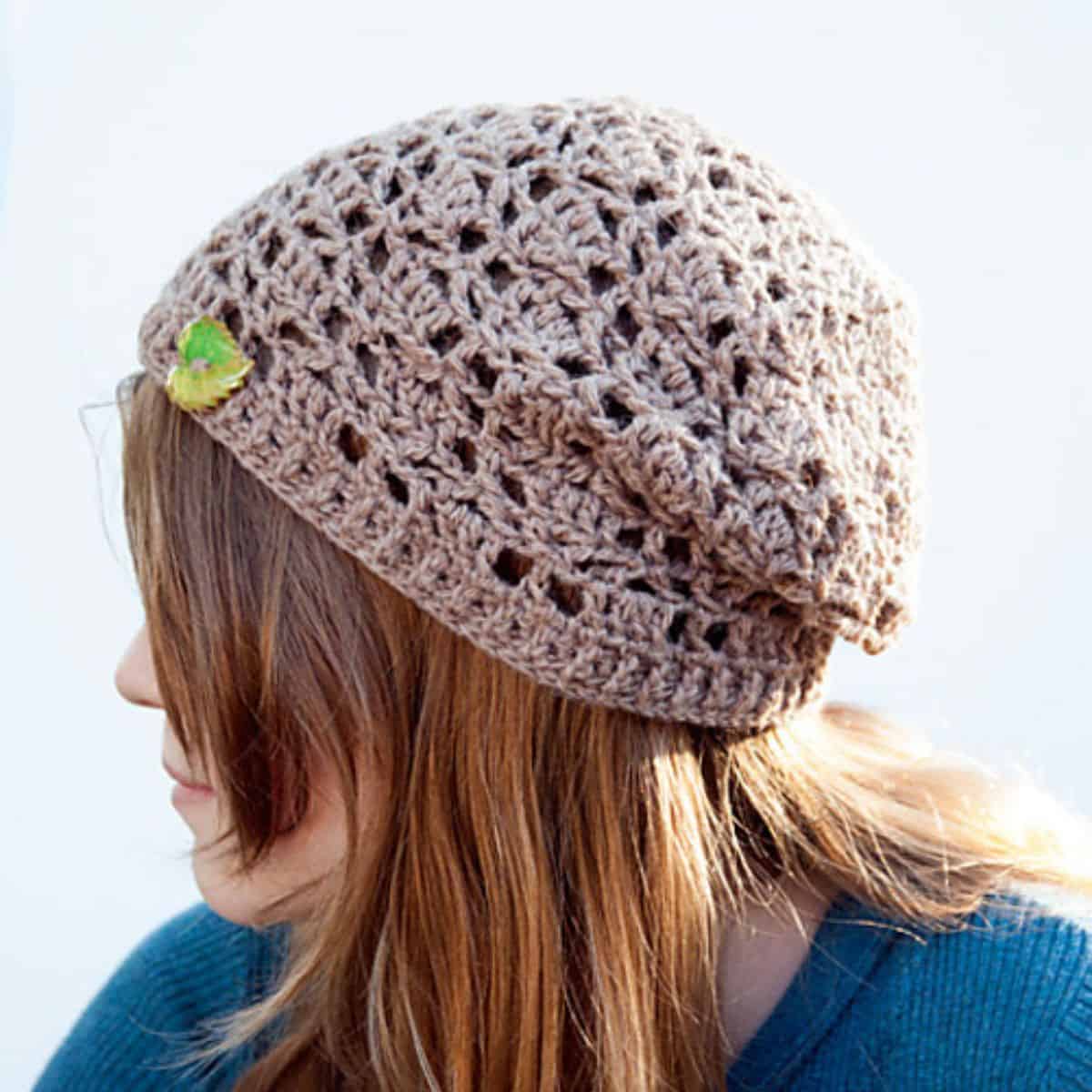 gray crochet slouchy hat on a woman