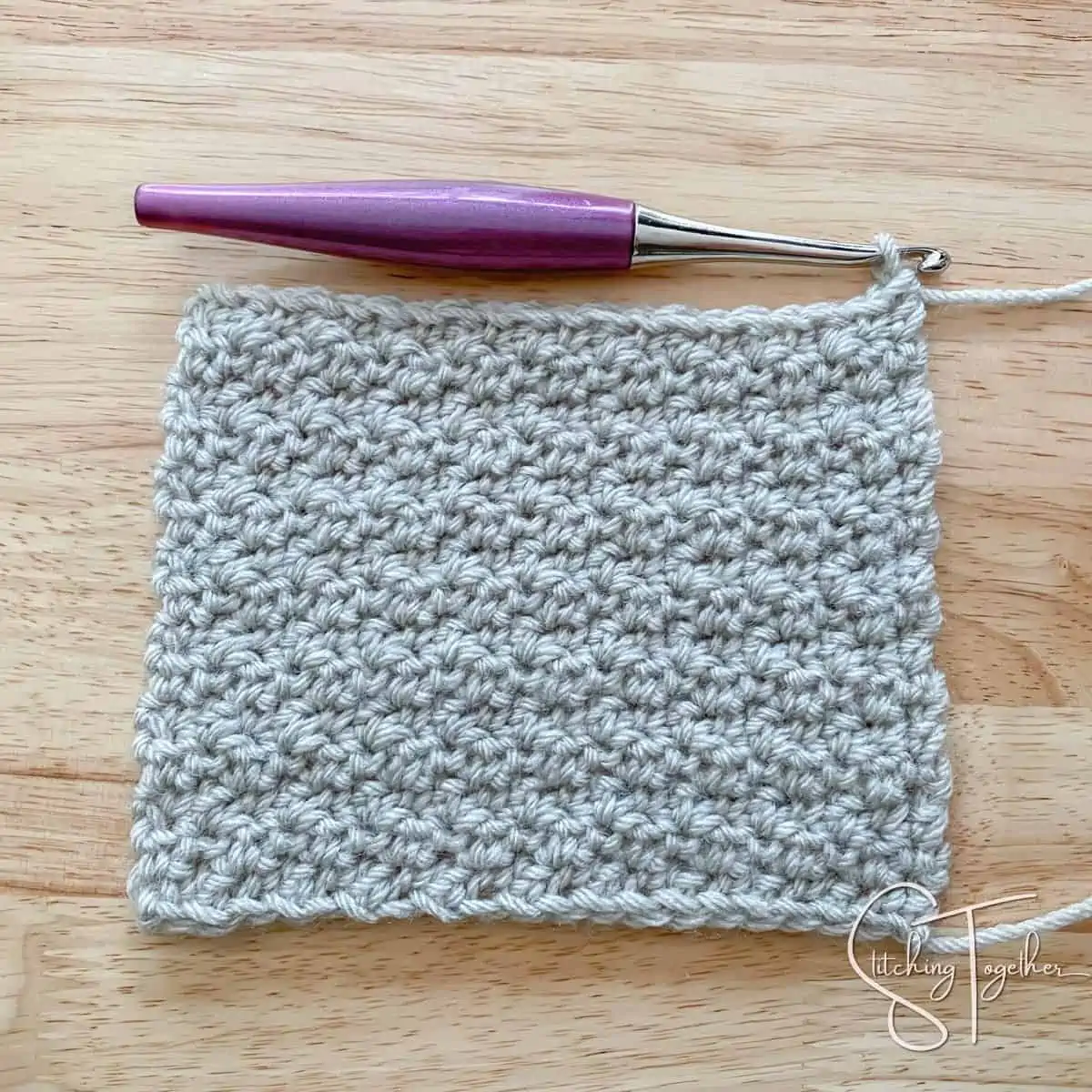 left handed lemon peel stitch crochet swatch with purple crochet hook