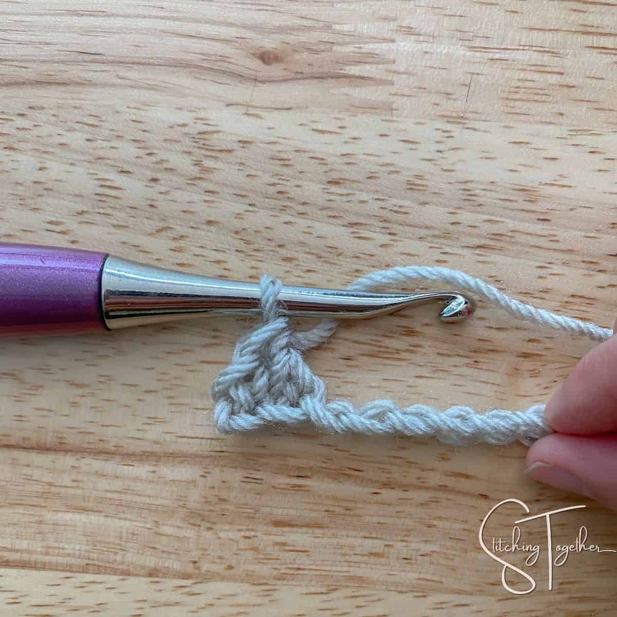 left side working a single crochet and double crochet into a chain