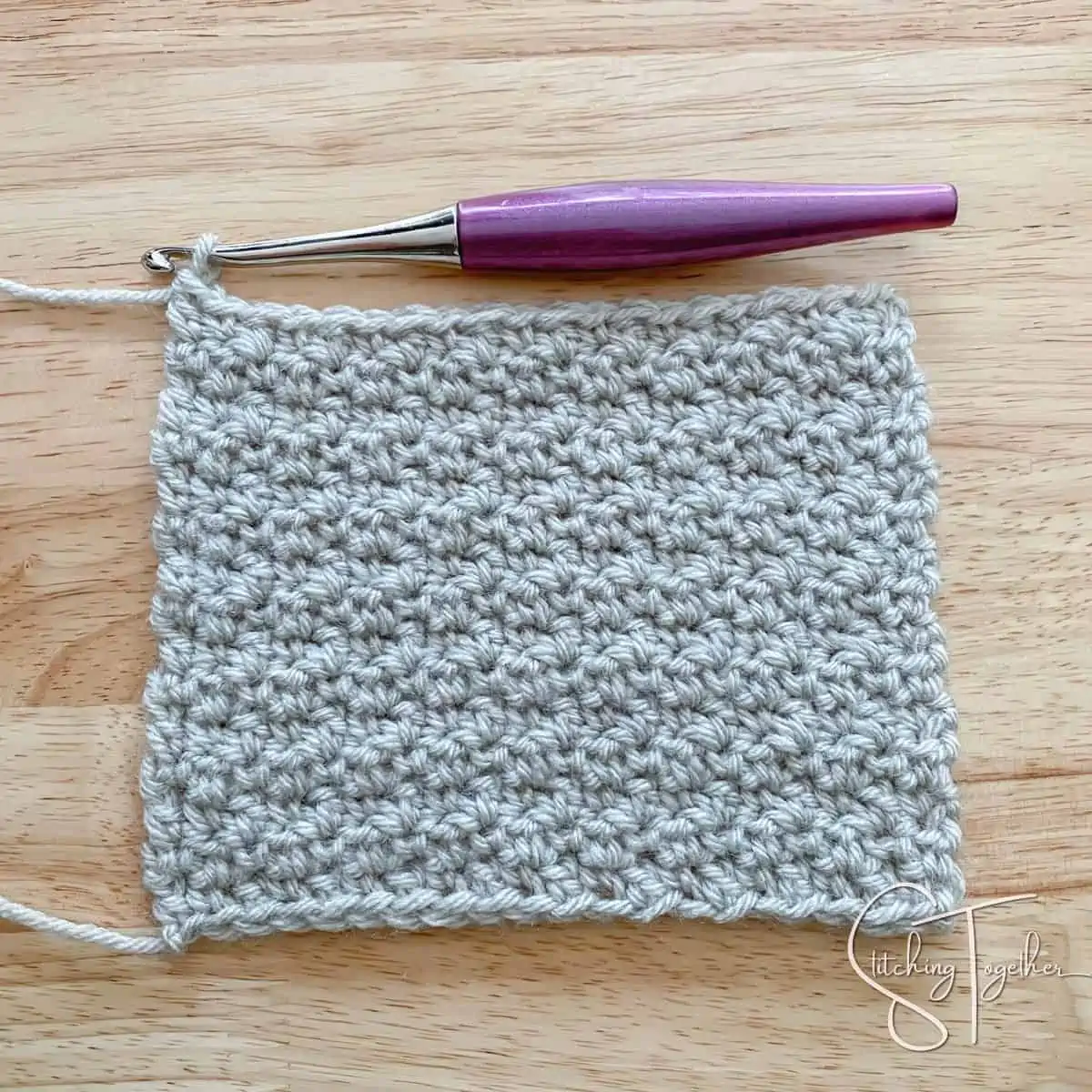 lemon peel stitch crochet swatch with purple crochet hook