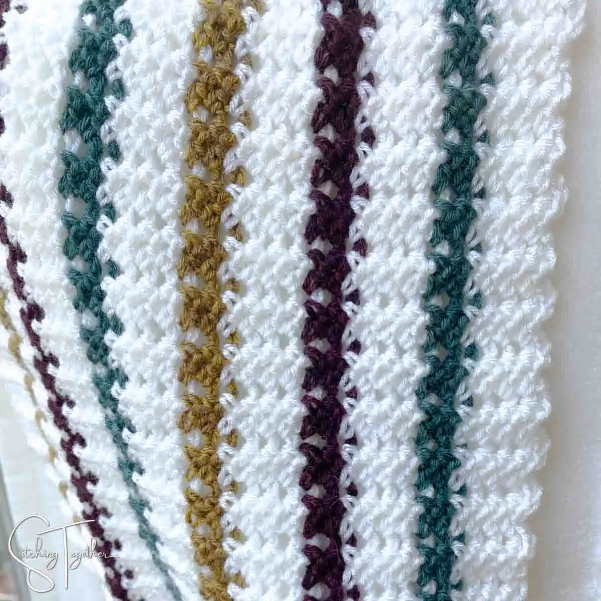 close up of striped lacy crochet stitches