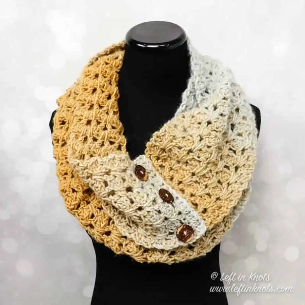 crochet scarf with buttons on a mannequin
