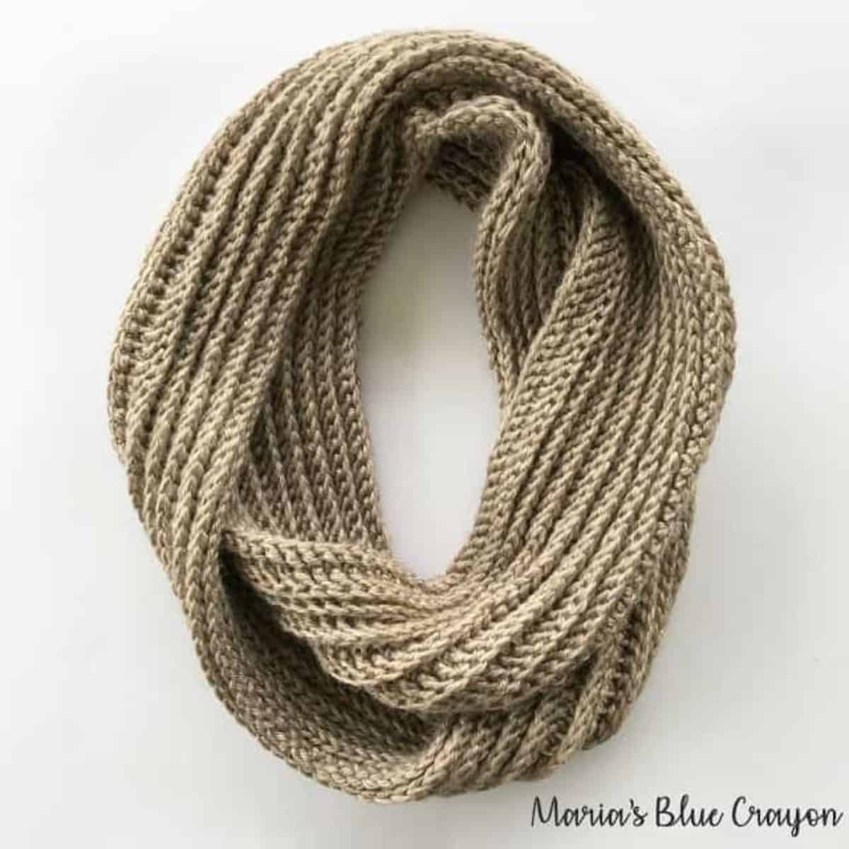 ribbed crochet infinity scarf circled on the ground