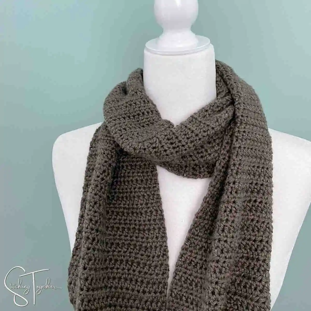 simple half double crochet scarf wrapped around the neck of a mannequin