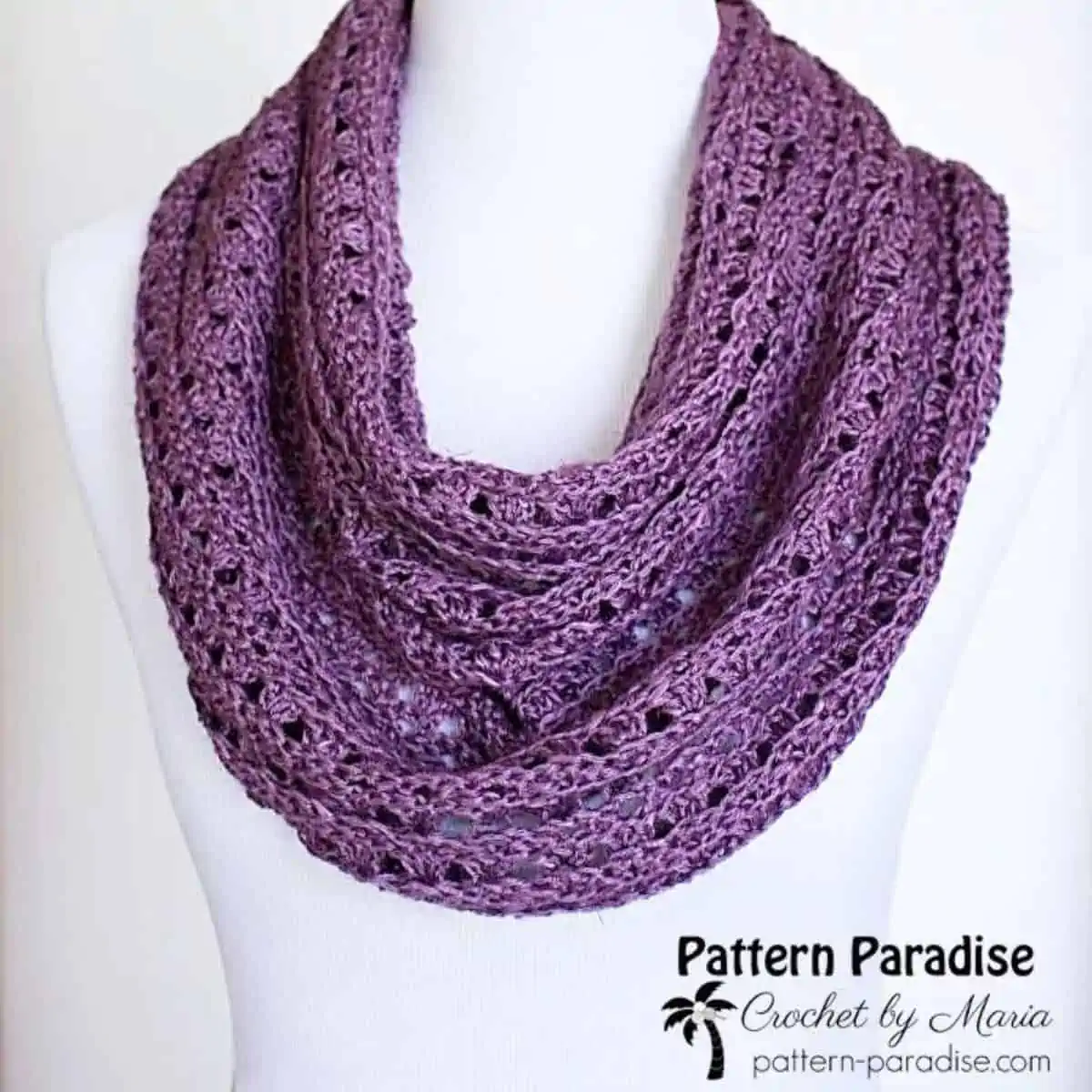 purple circle scarf draped on a mannequin