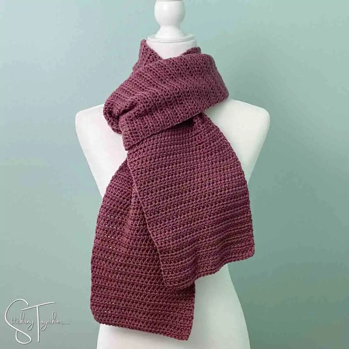 purple crochet scarf on a mannequin