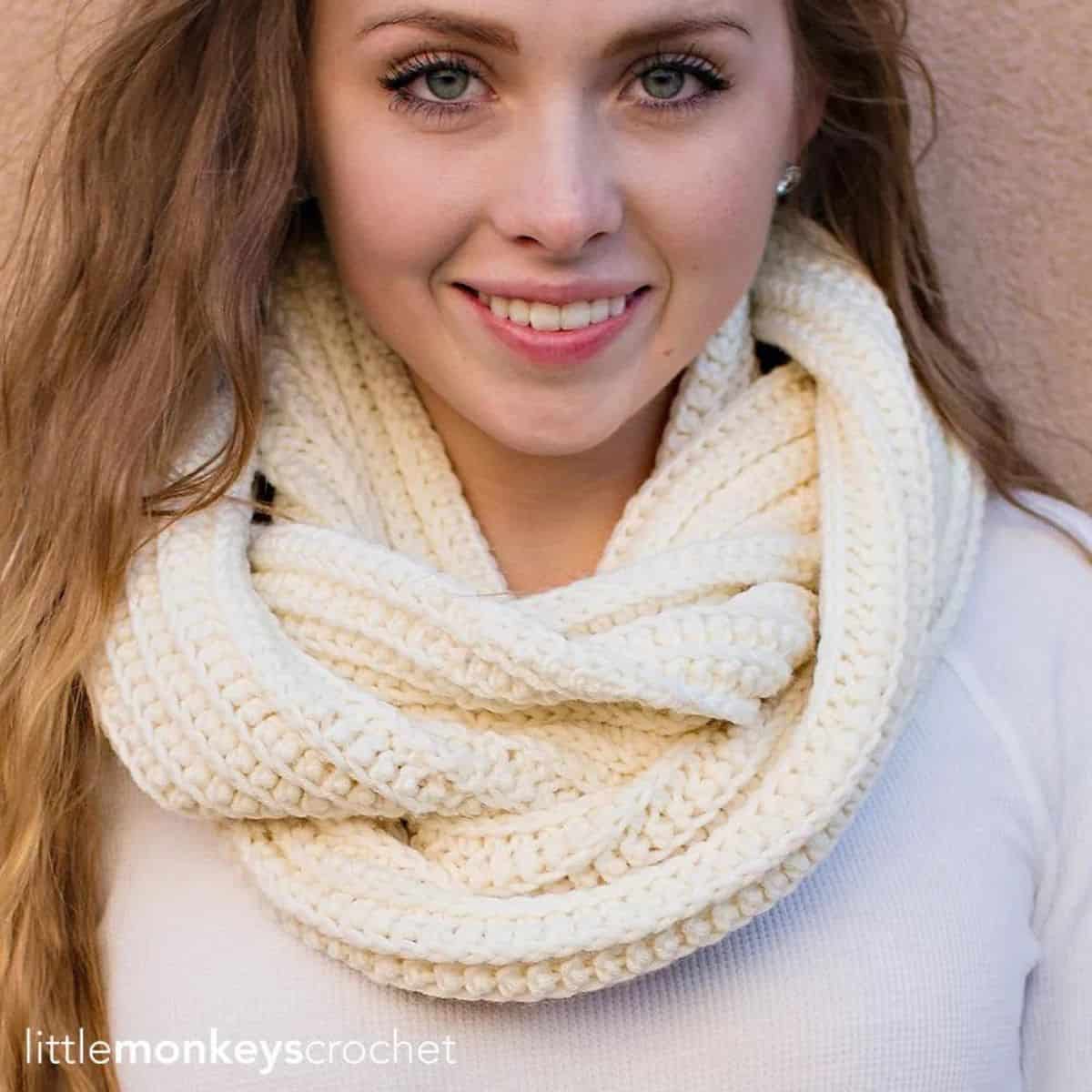 lady wearing and ivory colored infinity scarf