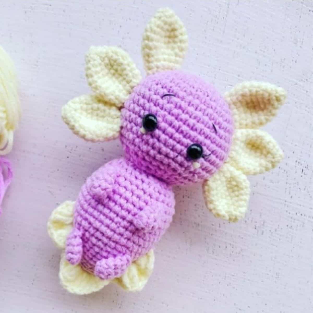 purple axolotl with yellow fins crochet toy