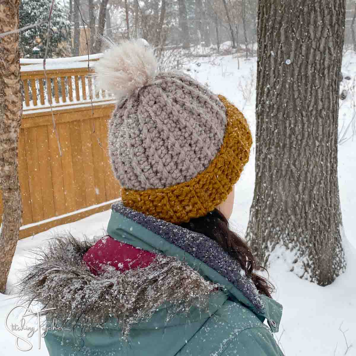 person wearing a crochet hat outside