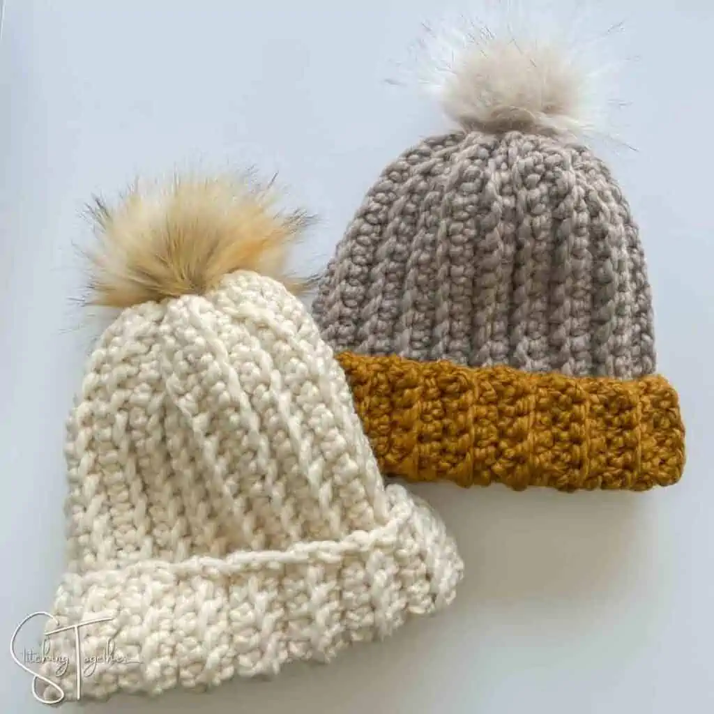 2 super chunky ribbed crochet hats with brims folded laying flat