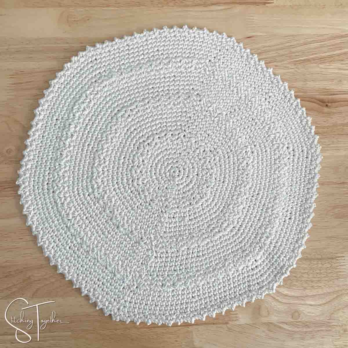 round crochet placemat before blocking