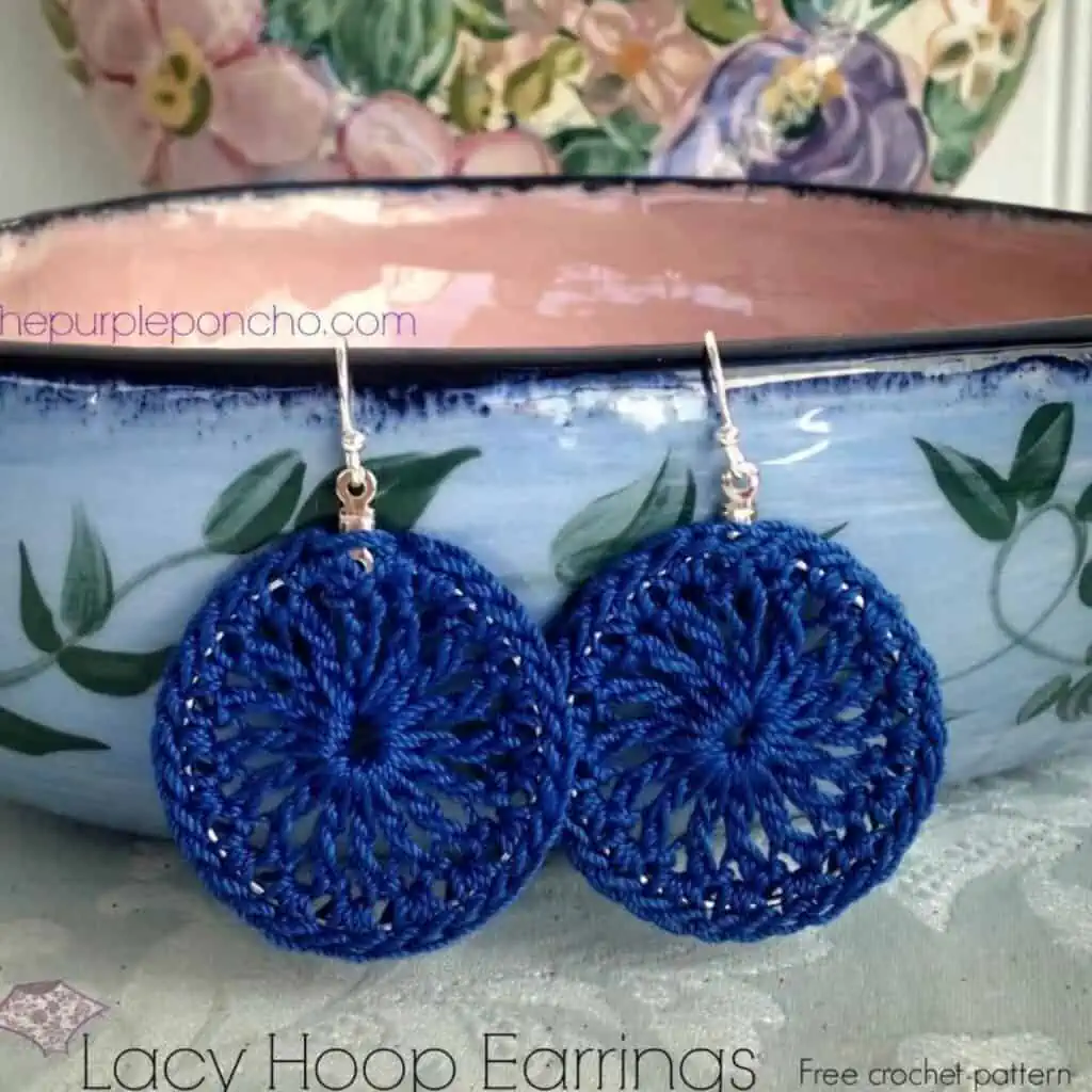 crochet earrings hanging on the side of a bowl