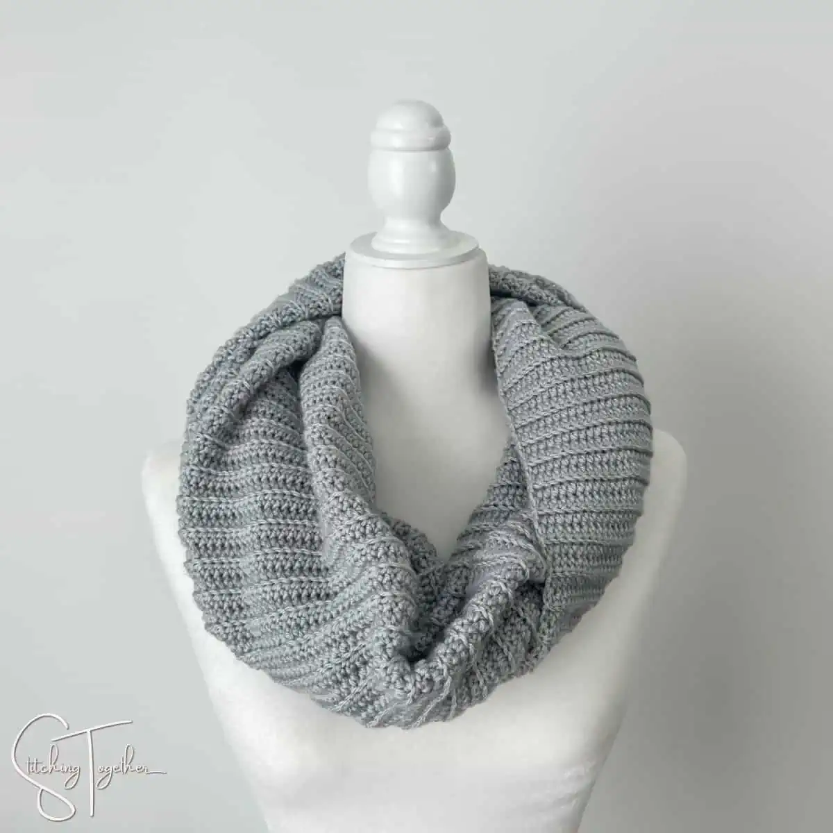 ribbed infinity crochet scarf on a mannequin