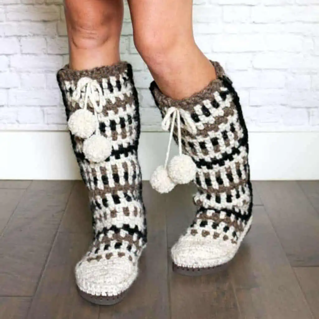 legs wearing tall crochet slippers