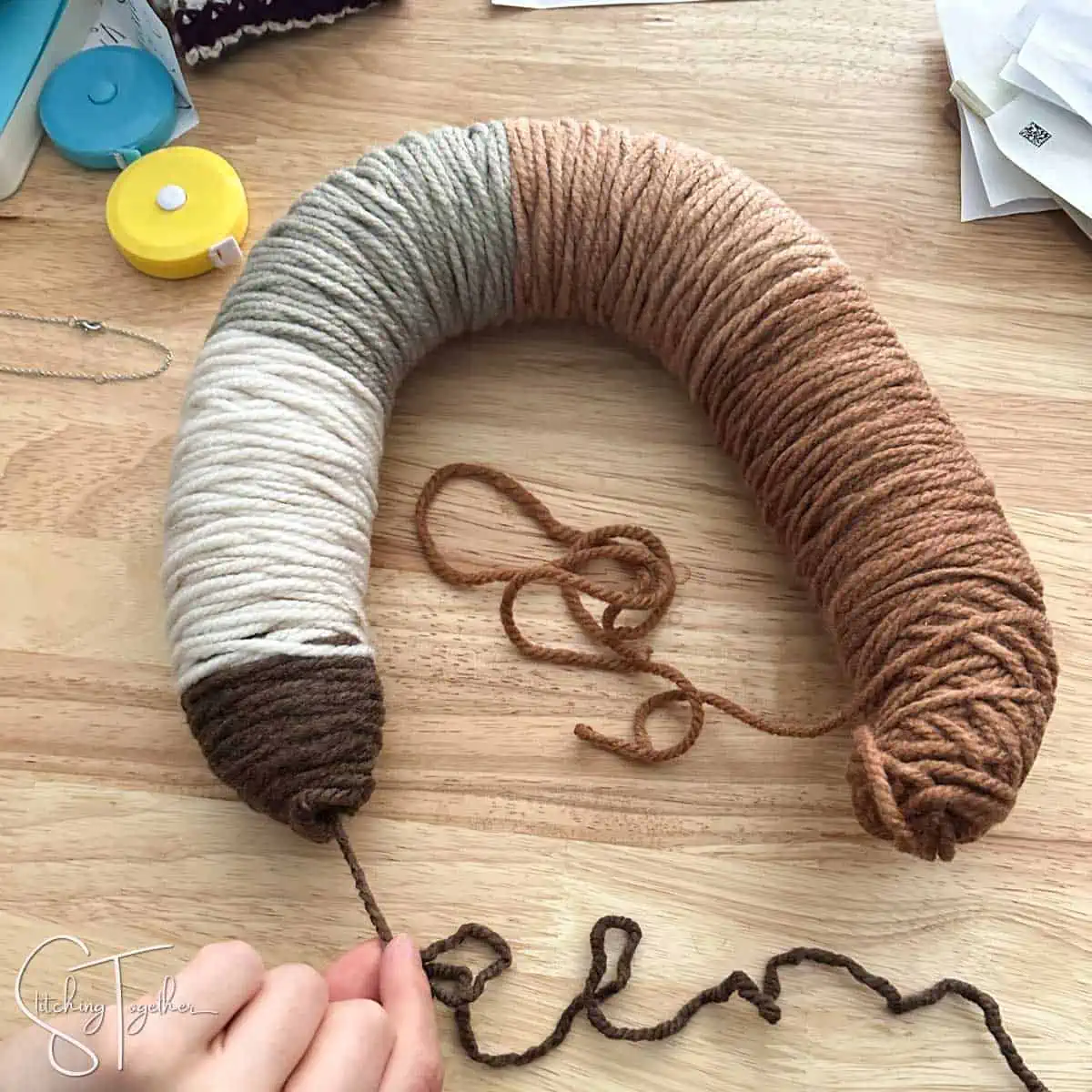 yarn being pulled from an O'GO yarn ring