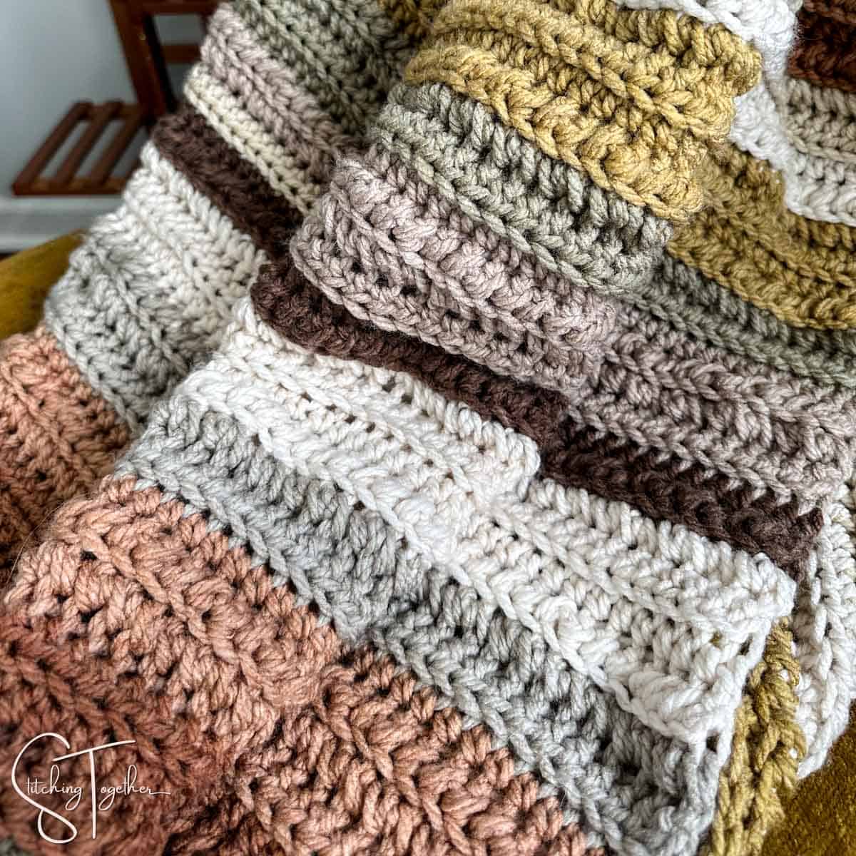 close up of textured crochet stitches in a chunky blanket