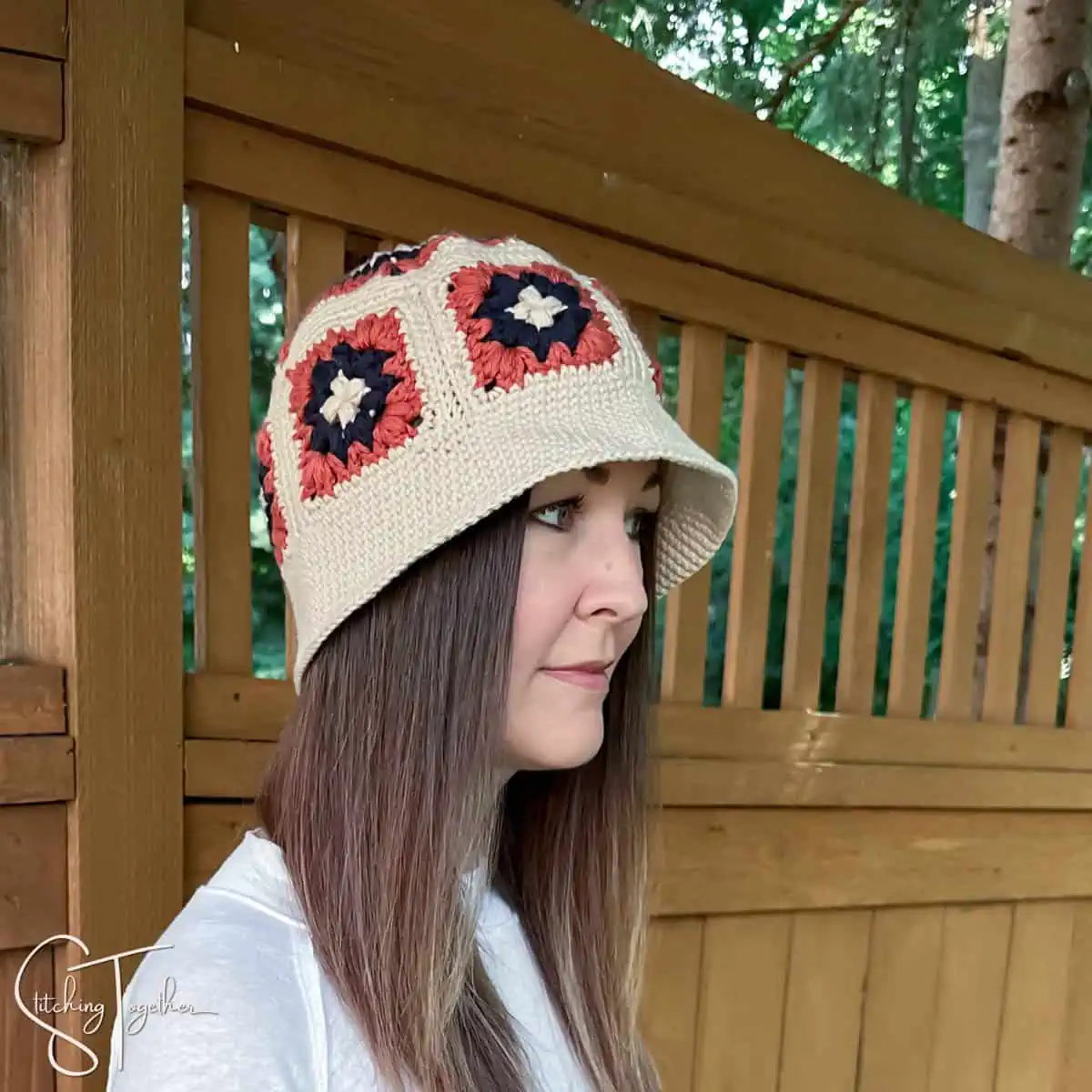 woman wearing a granny square hat