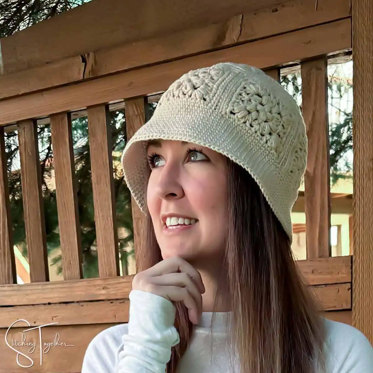 one color crochet bucket hat with granny squares on a woman