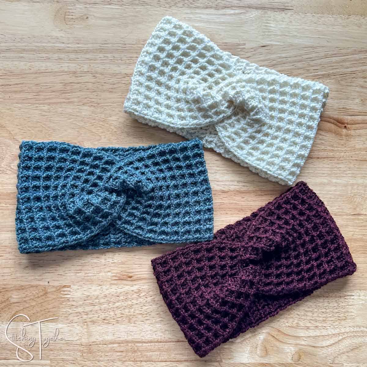 3 waffle stitch crochet twisted headbands laying flat