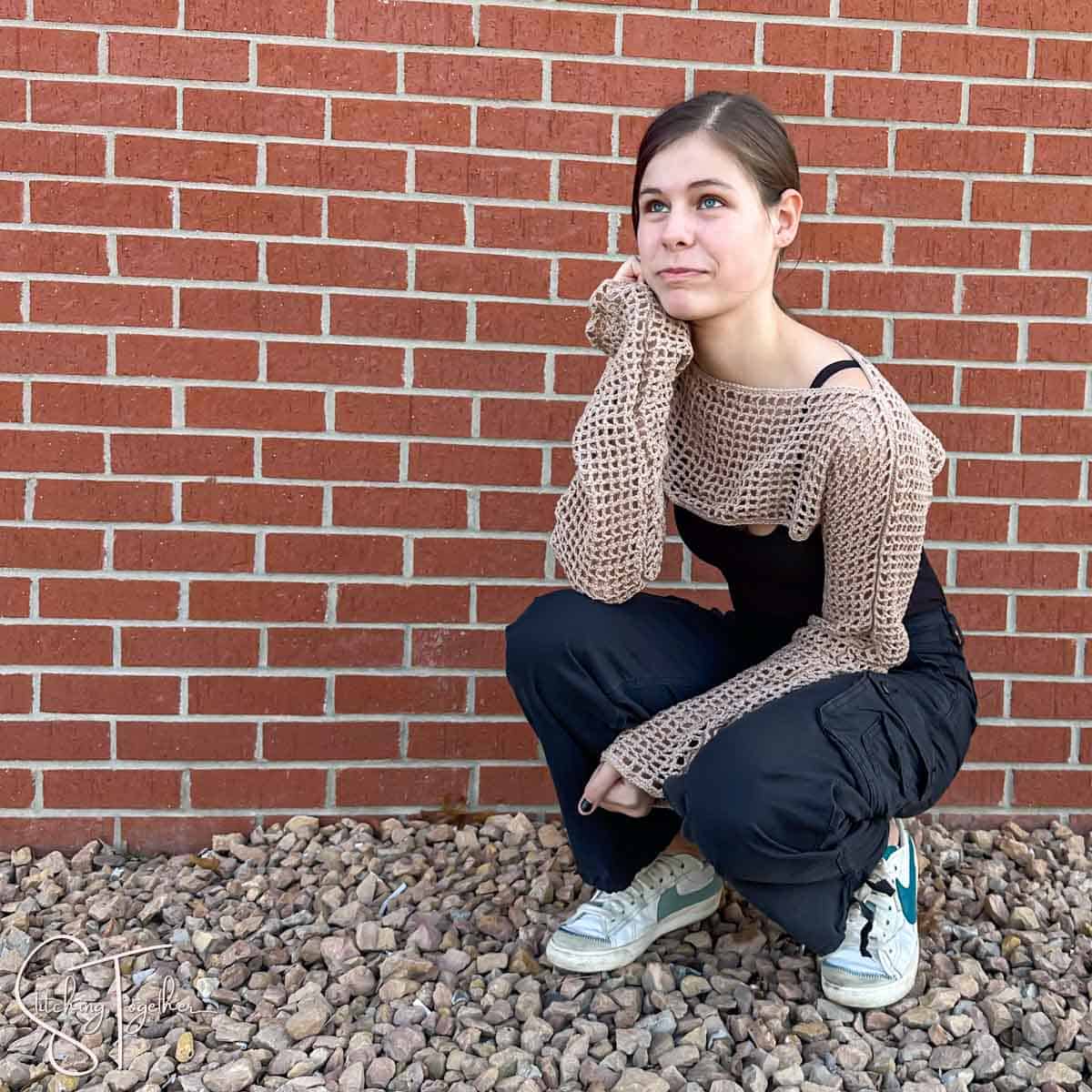 teen girl modeling a crochet crop sweater