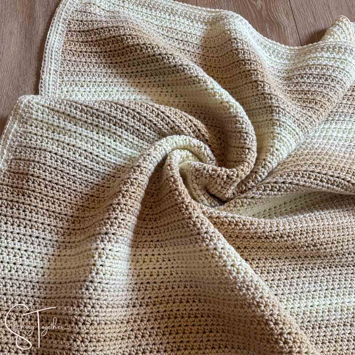 close up of crochet baby blanket