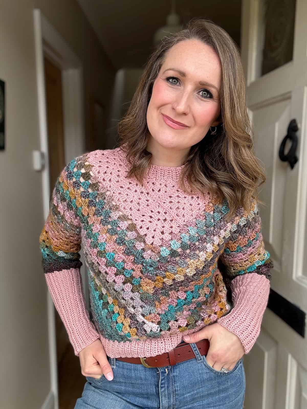 beautiful lady wearing a crochet granny square sweater