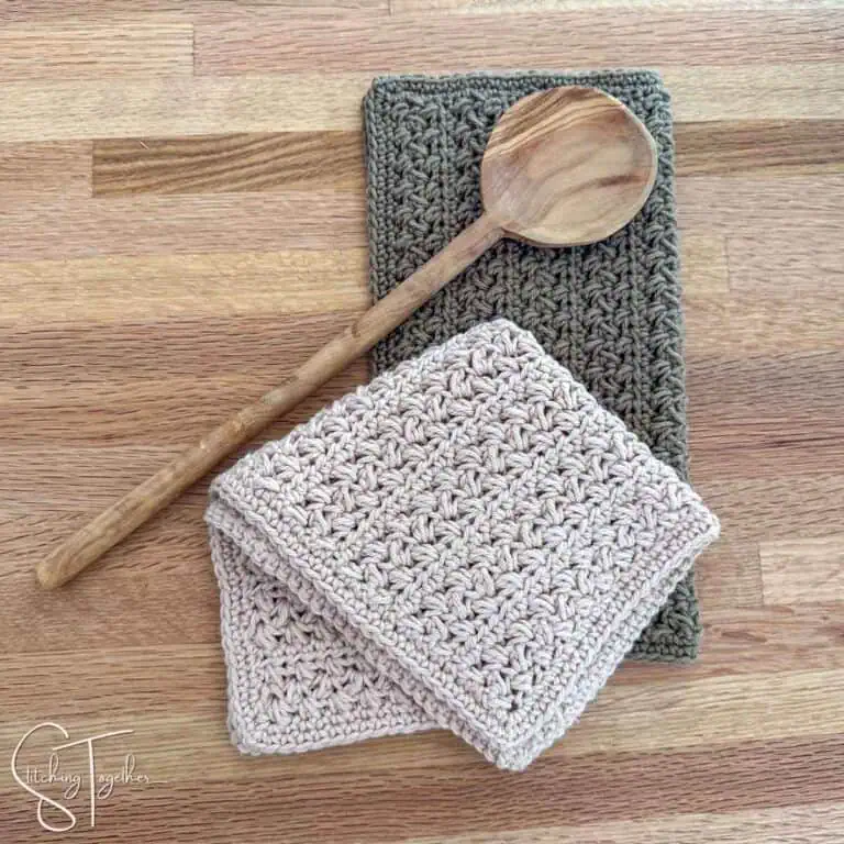 2 farmhouse crochet dishcloths that are folded wooden spoon laying on top