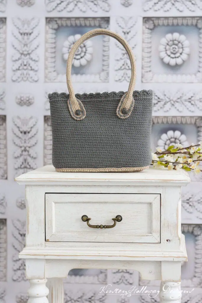 crochet tote bag sitting on an end table
