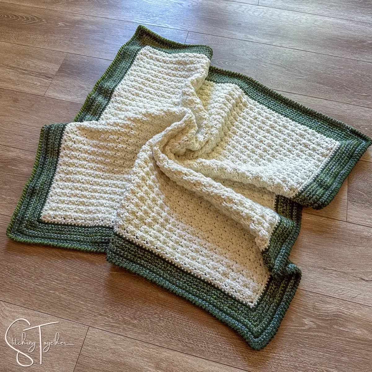 baby blanket bunched on the floor