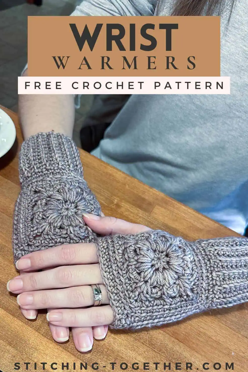 hands wearing crochet wrist warmers with text overlay reading "wrist warmers free crochet pattern"